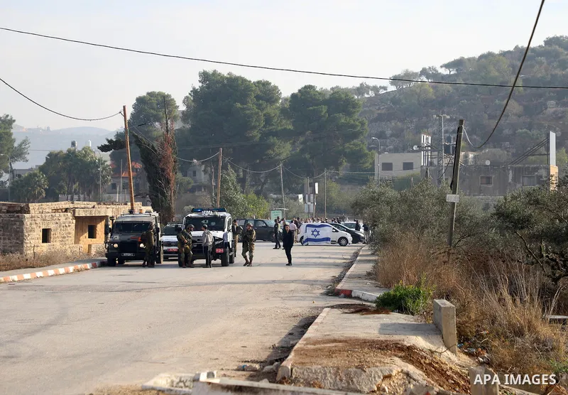 Israeli forces and Palestinian demonstrators clash in the village of al-Lubban al-Sharqiya in the Israeli-occupied West Bank on November 25, 2021. Photo by Wajed Nobani
