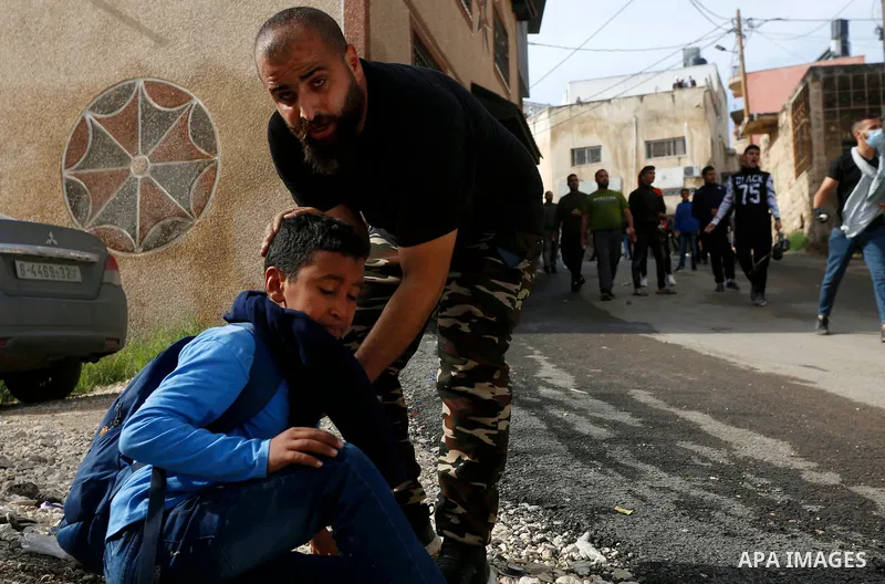 Israeli forces and Palestinian demonstrators clash in the village of al-Lubban al-Sharqiya in the Israeli-occupied West Bank on November 25, 2021. Photo by Ayman Ameen