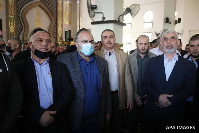 Palestinians attend the funeral of Hamas leader Abd al-Salam Siam who died of the coronavirus (COVID-19) pandemic in Gaza City, on November 29, 2021. Photo by Ashraf Amra