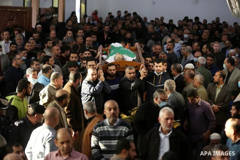Palestinians attend the funeral of Hamas leader Abd al-Salam Siam who died of the coronavirus (COVID-19) pandemic in Gaza City, on November 29, 2021. Photo by Ashraf Amra