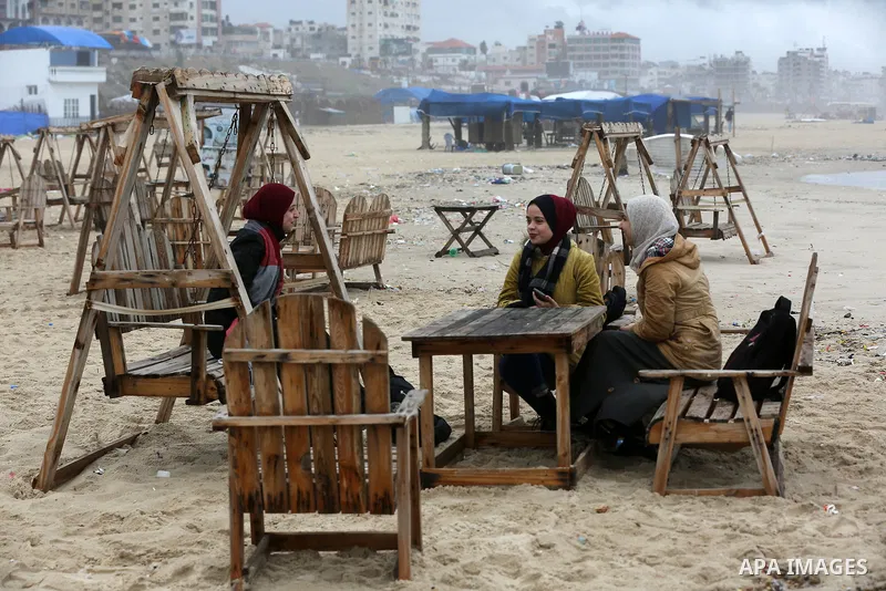 Palestinians show as they in their daily lives during a rainy day, in Gaza City December 01, 2021. A low-pressure front is expected to affect Palestine today, thus weather conditions are set to be partly cloudy to cloudy...