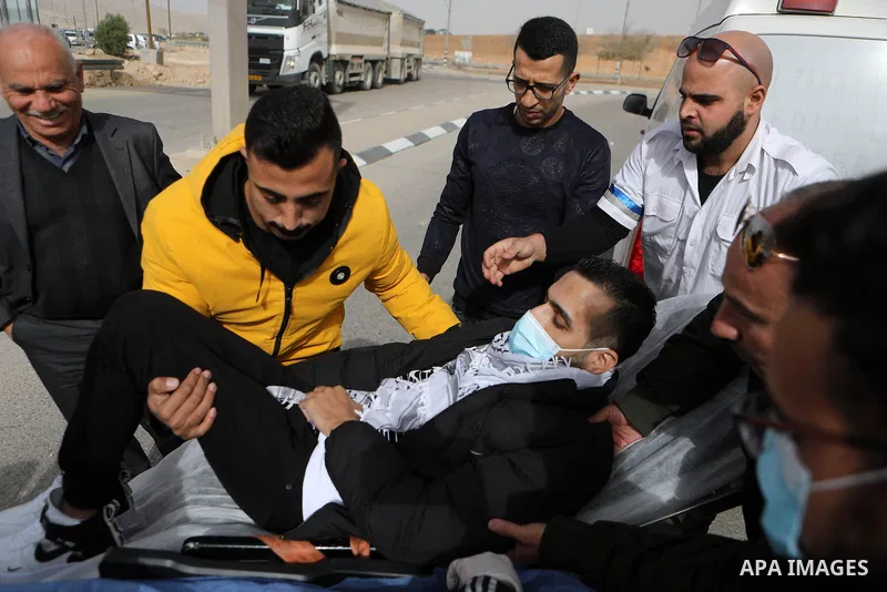 Palestinian prisoner Kayed al-Fasfous greets people after Israeli authorities released him following after he concluded 131 days of hunger strike, in the West Bank city of Hebron, on December 5, 2021. On November 23, Fas...