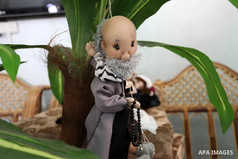 Palestinian woman Wala' Mousa makes dolls depicting Palestinian heritage in the Nuseirat camp in the central Gaza Strip on December 6, 2021. Palestinians enjoy a rich cultural heritage. The Palestinian people have lived...