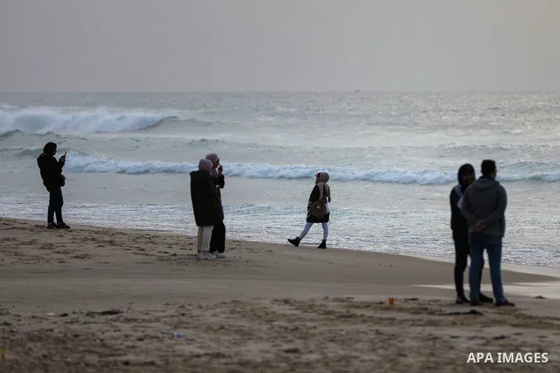 Palestinians enjoy their time on the beach, in Gaza City, On December 6, 2021. The beach is one of the few open public spaces in this densely populated city. Photo by Atia Darwish