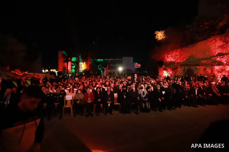 Palestinian Prime Minister Mohammed Ishtayeh attends a Christmas tree lighting in the West Bank city of Ramallah on December 6, 2021. Photo by Ibrahim Atta
