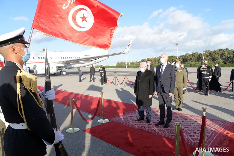 Palestinian president Mahmud Abbas meets with Tunisia's President Kais Saied at Tunis–Carthage International Airport on December 7, 2021. Photo by Thaer Ganaim