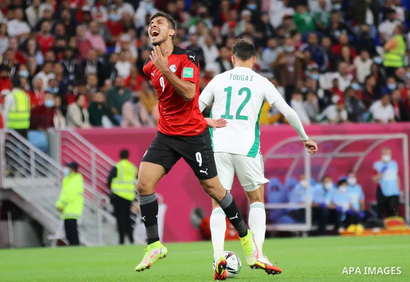 Egyptian football team players fight with Algerian football team players during the FIFA Arab Cup 2021 group D football match at the Al-Janoub Stadium in the Qatari city of Al-Wakrah on December 7, 2021. Photo by Youssef...