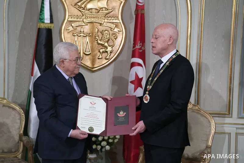 Palestinian president Mahmud Abbas meets with Tunisia's President Kais Saied at Tunis–Carthage International Airport on December 8, 2021. Photo by Thaer Ganaim