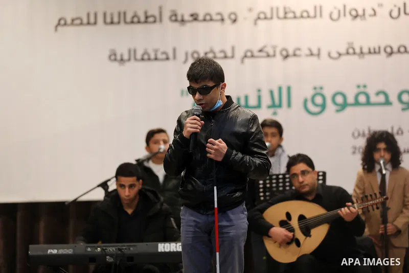 Palestinians attend musical show marking International Human Rights Day, in Gaza city on December 9, 2021. Photo by Majdi Fathi