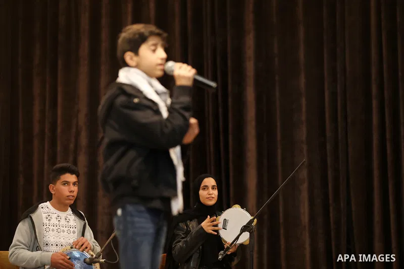Palestinians attend musical show marking International Human Rights Day, in Gaza city on December 9, 2021. Photo by Majdi Fathi