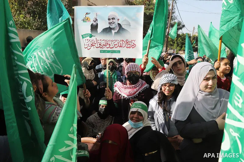 Palestinian Hamas supporters take part during a rally marking the 34th anniversary of the founding of the Hamas movement, in Gaza city on December 10, 2021. Photo by Omar Ashtawy