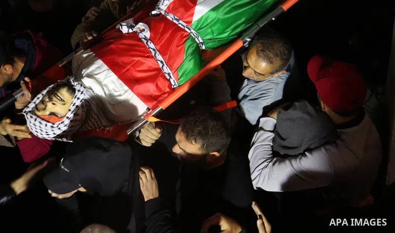 Palestinians carry the body of a Jamil Abu Ayyash, 31, who was shot killed by Israeli forces during his funeral in the West Bank city of Nablus, on December 10, 2021. Abu Ayyash suffered a gunshot wound to the head durin...