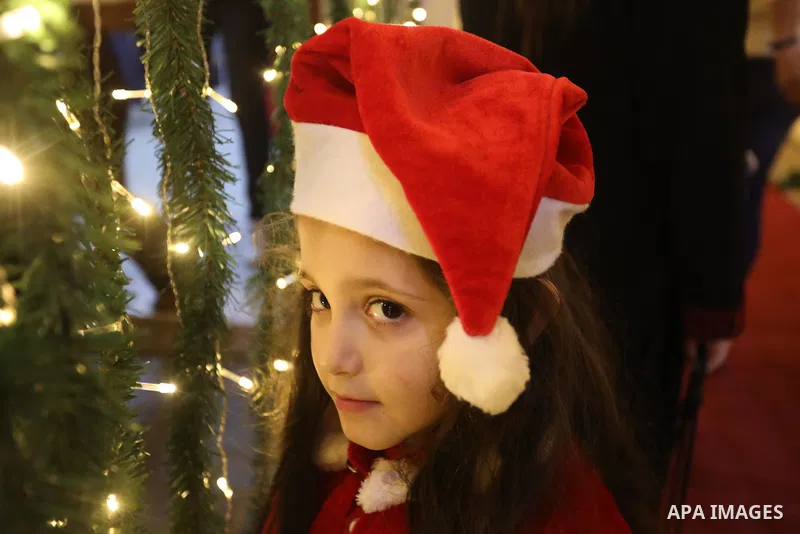 Palestinians gather to celebrate the lighting of the Christmas tree in Gaza city on December 10, 2021. Photo by Ashraf Amra