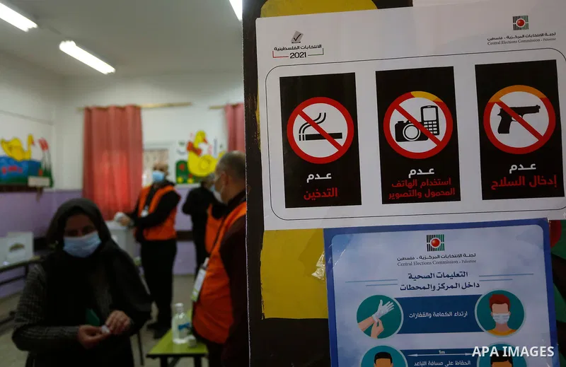 Palestinian voters cast their vote in the first phase of local elections in village of Deir al-Hatab, east of Nablus in the West Bank, on December 12, 2021. Polls opened this morning for the first phase of local election...
