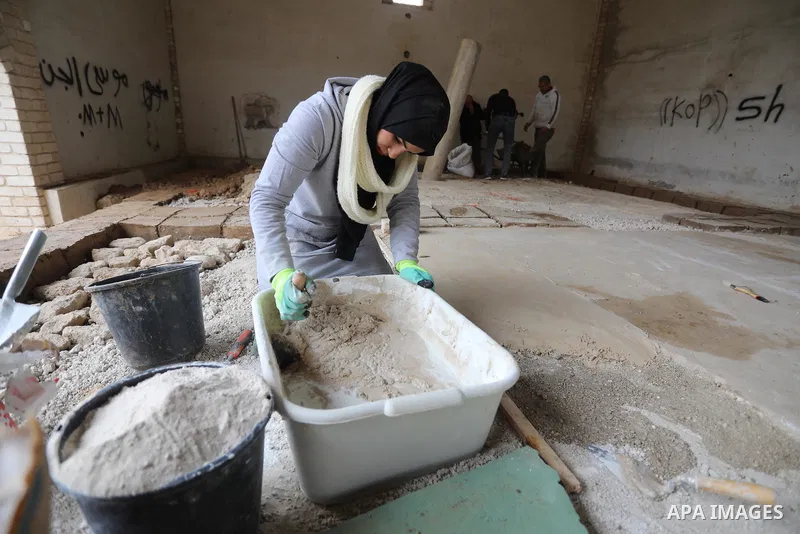 Volunteers and archaeologists restore the floor of the Byzantine church mosaic, in Khan Younis in the southern Gaza Strip, on December 20, 2021. The Iwan Center for Cultural Heritage at the Islamic University, in coopera...