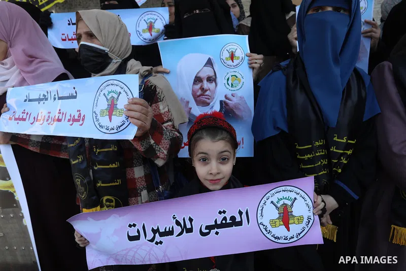 Supporters of Palestinian Islamic Jihad take part in a protest to show solidarity with female prisoners held in Israeli jails, in front of Red Cross office, in Gaza city, 22 December 2021. The female prisoners embarked m...