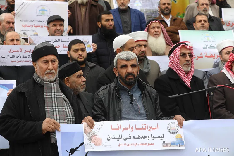 Members of the Palestine Scholars Association, attend a press conference, in Gaza city on December 23, 2021. PPS said the prison authorities imposed several repression measures against female prisoners, including cutting...