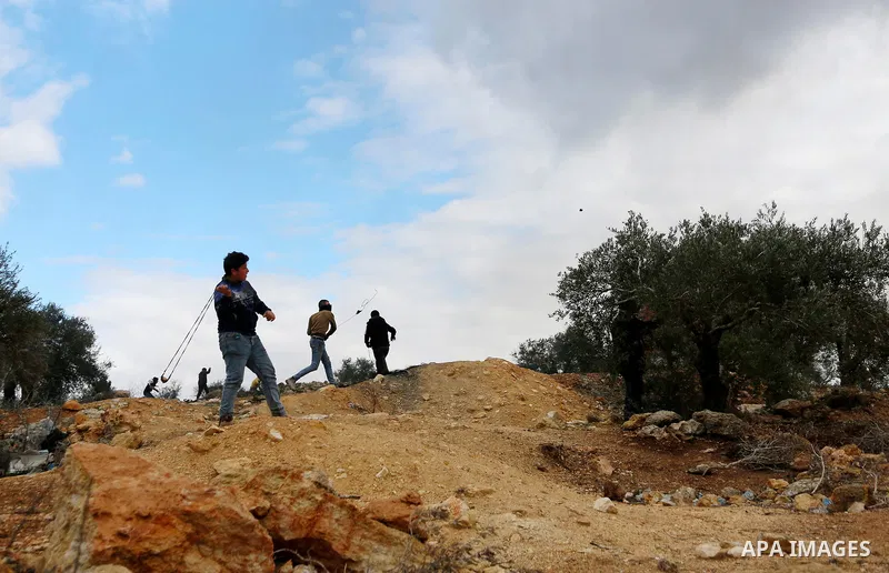 Palestinian protesters clash with Israeli security forces following a demonstration against settlements in the village of Beita in the West Bank, on December 24, 2021. Photo by Shadi Jarar'ah