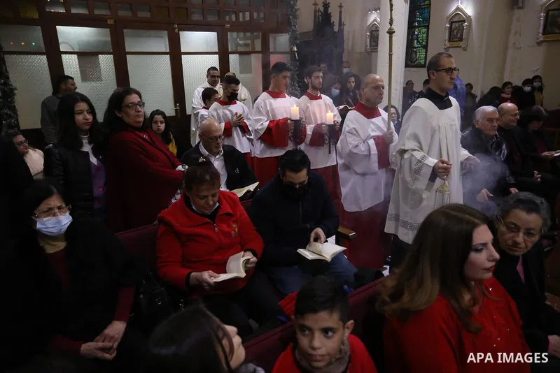 Palestinian Christians attend Christmas mass eve at the Roman Catholic Church of the Holy Family in Gaza City on December 24, 2021. Photo by Ashraf Amra