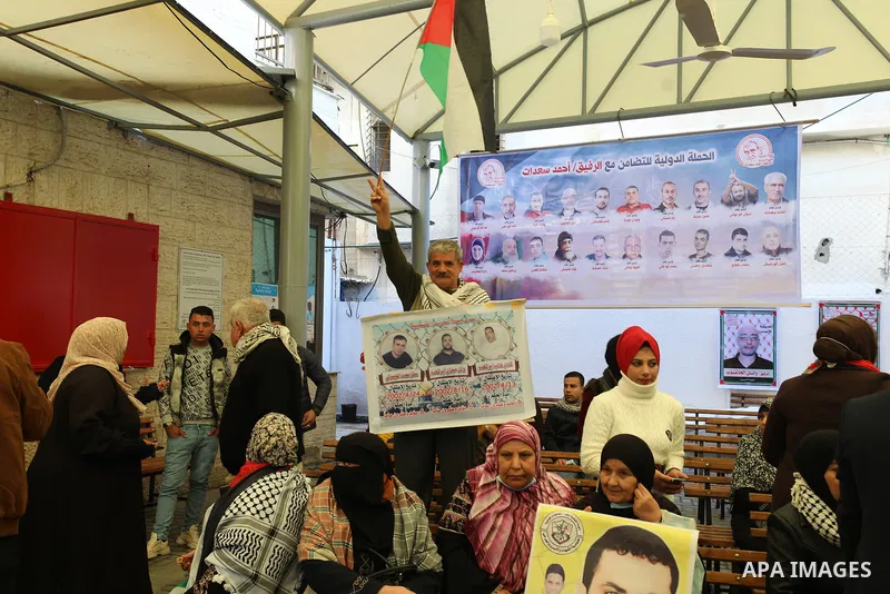 Palestinians take part in a protest to show solidarity with female prisoners held in Israeli jails, ​in front of Red Cross office in Gaza city, on December 27, 2021. Palestinian administrative detainees usually resort to...