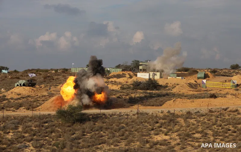 Palestinian factions militants take part in joint military exercise, in Rafah in the southern of Gaza strip on December 29, 2021. Photo by Ashraf Amra