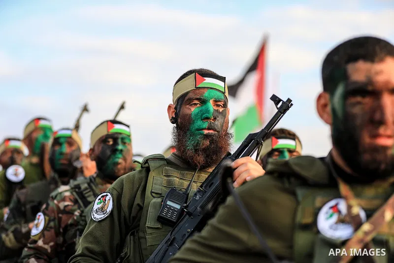 Palestinian factions militants take part in a joint military exercise, in Rafah in the southern of Gaza strip on December 29, 2021. Photo by Atia Darwish