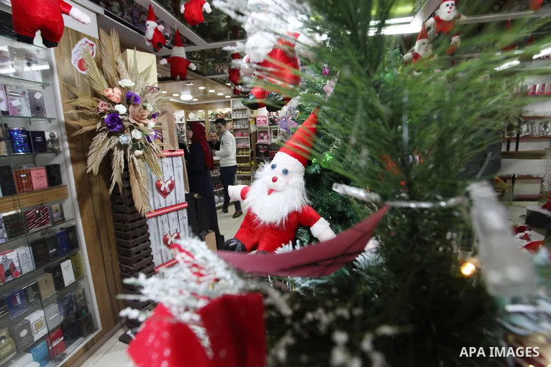 Palestinian vendors display gifts and decoration ahead of New Year's eve, at a shop in Gaza city on December 31, 2021. Gazans hope for peace, prosperity in 2022 after the recent 11-day conflict between Israel and Hamas o...