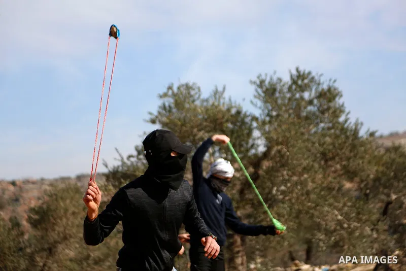 Palestinian protesters clash with Israeli security forces following a demonstration against settlements in the village of Beita in the West Bank, on December 31, 2021. Photo by Shadi Jarar'ah