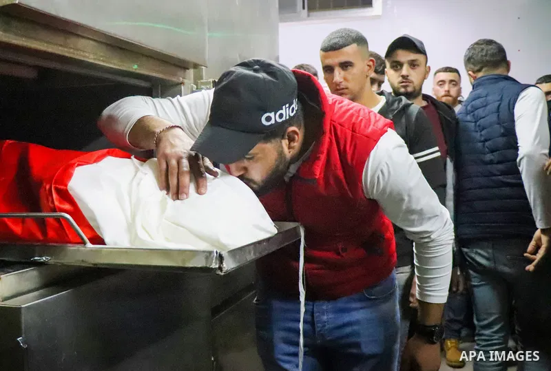 Relaives of Mohammad Mater who was shot killed by Israeli forces mourn over his body after Israeli authorities handed over it, at hospital in the West Bank city of Ramallah, on December 3, 2021. Israeli authorities today...