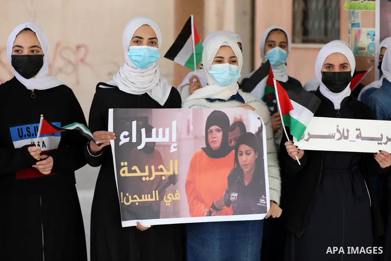 Palestinian school girls take part in a protset in solidarity with female prisoners at Israeli jails in Gaza city on December 8, 2021. Photo by APA