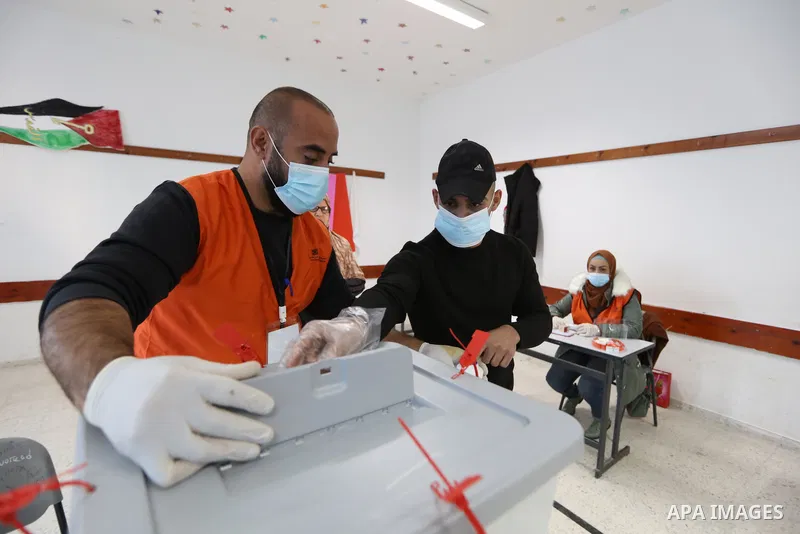 Palestinian voters cast their vote in the first phase of local elections in the West Bank city of Bethlehem on December 11, 2021. Polls opened this morning for the first phase of local elections at 154 Palestinian locali...