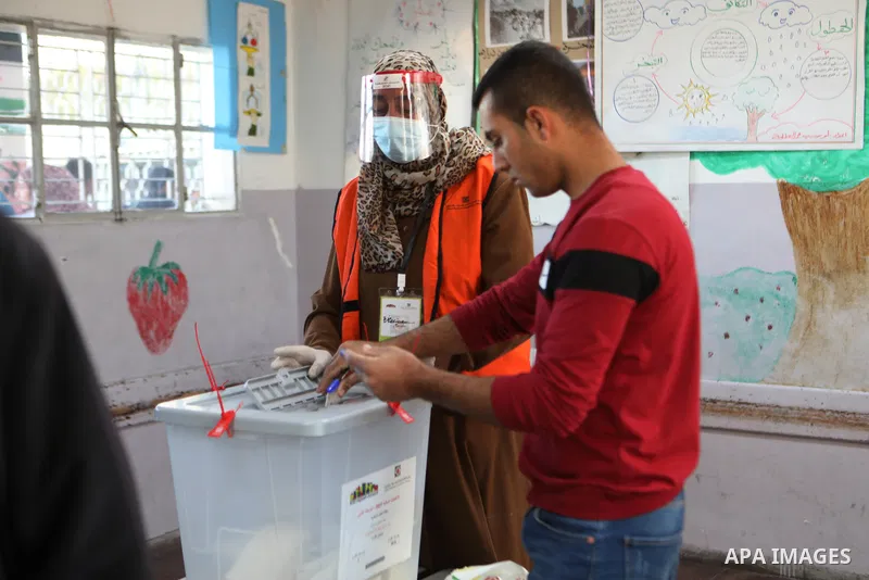 Palestinian voters cast their vote in the first phase of local elections in the West Bank city of Hebron on December 11, 2021. Polls opened this morning for the first phase of local elections at 154 Palestinian localitie...