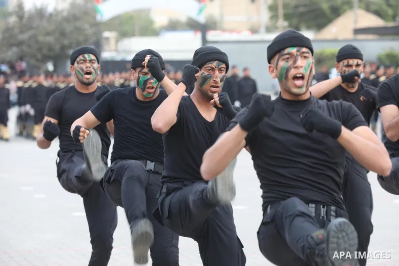 Members of Palestinian security forces take part in a graduation ceremony in Gaza City December 12, 2021. Photo by Ashraf Amra