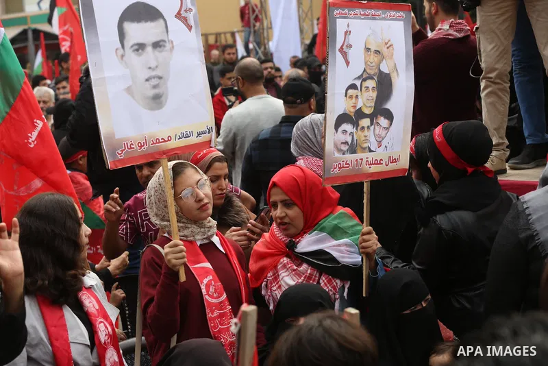 Palestinian supporters of the Popular Front for the Liberation of Palestine (PFLP) take part during a rally marking the 54th anniversary of its founding in Gaza City on December 13, 2021. Photo by Ashraf Amra