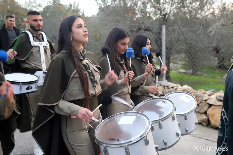 A scout band perform at streets during celebrations of Saint Barabara's Day, in the village of Aboud, in the West Bank city of Ramallah December 16, 2021. Photo by Wajed Nobani