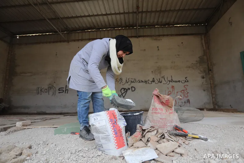 Volunteers and archaeologists restore the floor of the Byzantine church mosaic, in Khan Younis in the southern Gaza Strip, on December 20, 2021. The Iwan Center for Cultural Heritage at the Islamic University, in coopera...