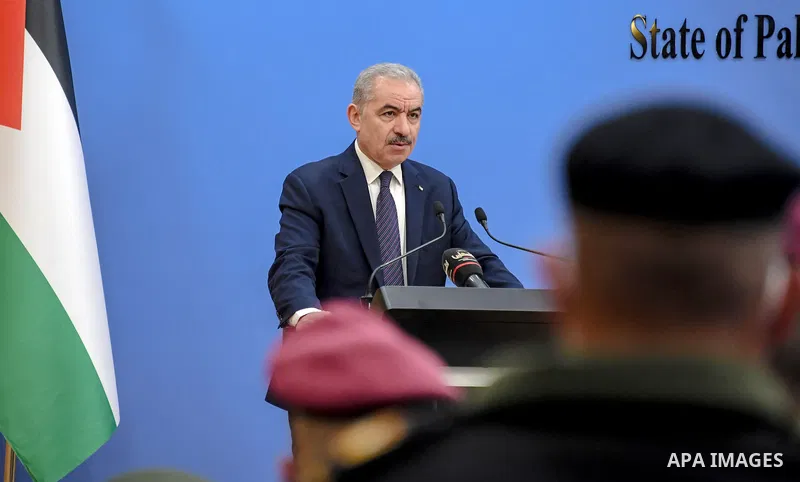 Palestinian Prime Minister Mohammed Ishtayeh honors members of Palestinian security forces, in the West Bank city of Ramallah on December 22, 2021. Photo by Shadi Hatem