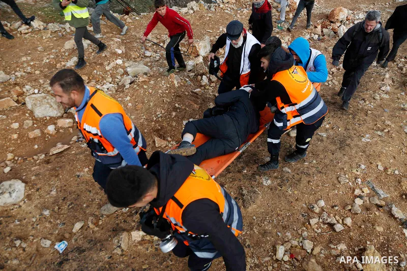 Palestinian protesters clash with Israeli security forces following a demonstration against settlements in the village of Beita in the West Bank, on December 24, 2021. Photo by Shadi Jarar'ah