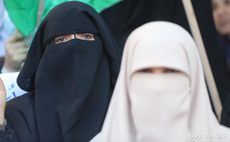 Palestinians take part in a protest to show solidarity with female prisoners held in Israeli jails, ​in front of Red Cross office in Gaza city, on December 26, 2021. Palestinian administrative detainees usually resort to...
