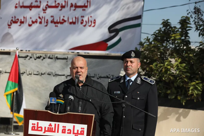 Palestinian policemen take part in the National Day of Martyrs of the Ministry of Interior and National Security marking the 13th anniversary of the Israeli war on Gaza Strip 2008-2009, in Gaza city on December 27, 2021....