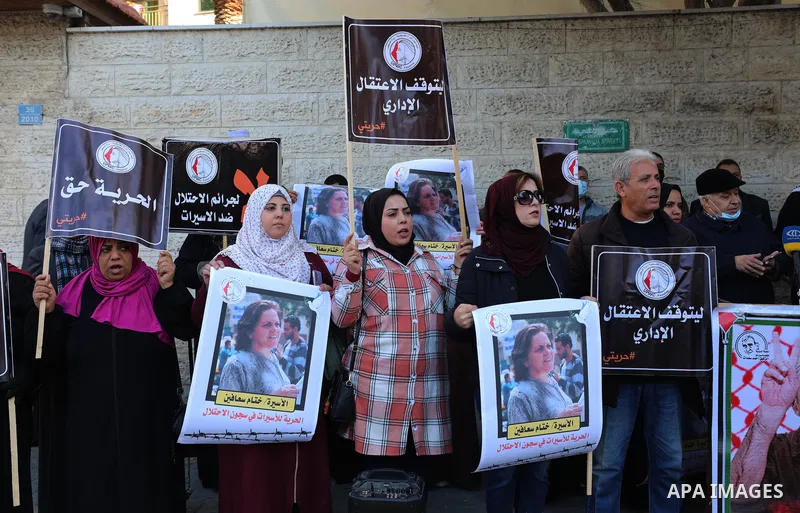 Palestinians take part in a protest to show solidarity with female prisoners held in Israeli jails, ​in front of Red Cross office in Gaza city, on December 27, 2021. Palestinian administrative detainees usually resort to...
