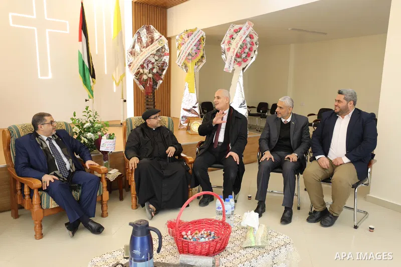 Palestinian delegation from Hamas visit the Roman Catholic Church of the Holy Family in Gaza city on December 28, 2021. Christmas is an annual festival commemorating the birth of Jesus Christ. Photo by Mahmoud Nasser