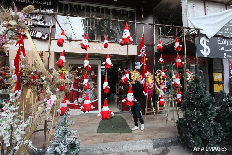 Palestinian vendors display gifts and decoration ahead of New Year's eve, at a shop in Gaza city on December 31, 2021. Gazans hope for peace, prosperity in 2022 after the recent 11-day conflict between Israel and Hamas o...