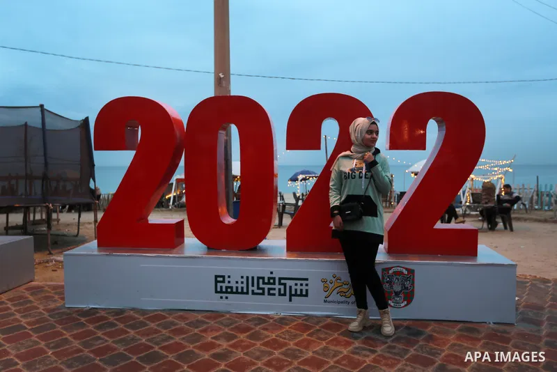 Palestinians enjoy their time on the last day of 2021 on the beach of Gaza sea on December 31, 2021. Gazans hope for peace, prosperity in 2022 after the recent 11-day conflict between Israel and Hamas on May. Photo by Mo...