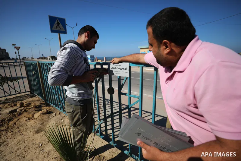 Palestinians plant trees in the names of children who were killed during the recent 11-day conflict between Israel and Hamas on May, in Gaza city, on November 6, 2021. Photo by Mahmoud Nasser