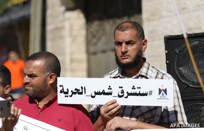 Palestinians take part in a protest in solidarity with prisoners on hunger strike at Israeli jails, in front of Red Cross office in Gaza city on November 8, 2021. Thousands of Palestinian political prisoners in Israeli p...