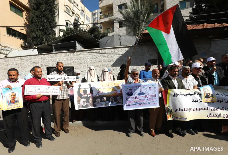 Palestinians take part in a protest in solidarity with prisoners on hunger strike at Israeli jails, in front of Red Cross office in Gaza city on November 8, 2021. Thousands of Palestinian political prisoners in Israeli p...