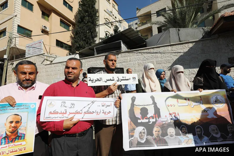 Palestinians take part in a protest in solidarity with prisoners on hunger strike at Israeli jails, in front of Red Cross office in Gaza city on November 8, 2021. Thousands of Palestinian political prisoners in Israeli p...