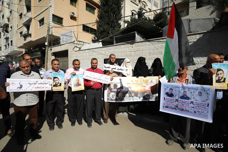 Palestinians take part in a protest in solidarity with prisoners on hunger strike at Israeli jails, in front of Red Cross office in Gaza city on November 8, 2021. Thousands of Palestinian political prisoners in Israeli p...