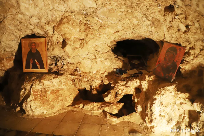 Tourists visit the Qarantal Monastery, also known as the Mount of Temptation, where Christians believe Jesus was tempted by the devil, in the West Bank town of Jericho, on November 10, 2021. Photo by Wajed Nobani